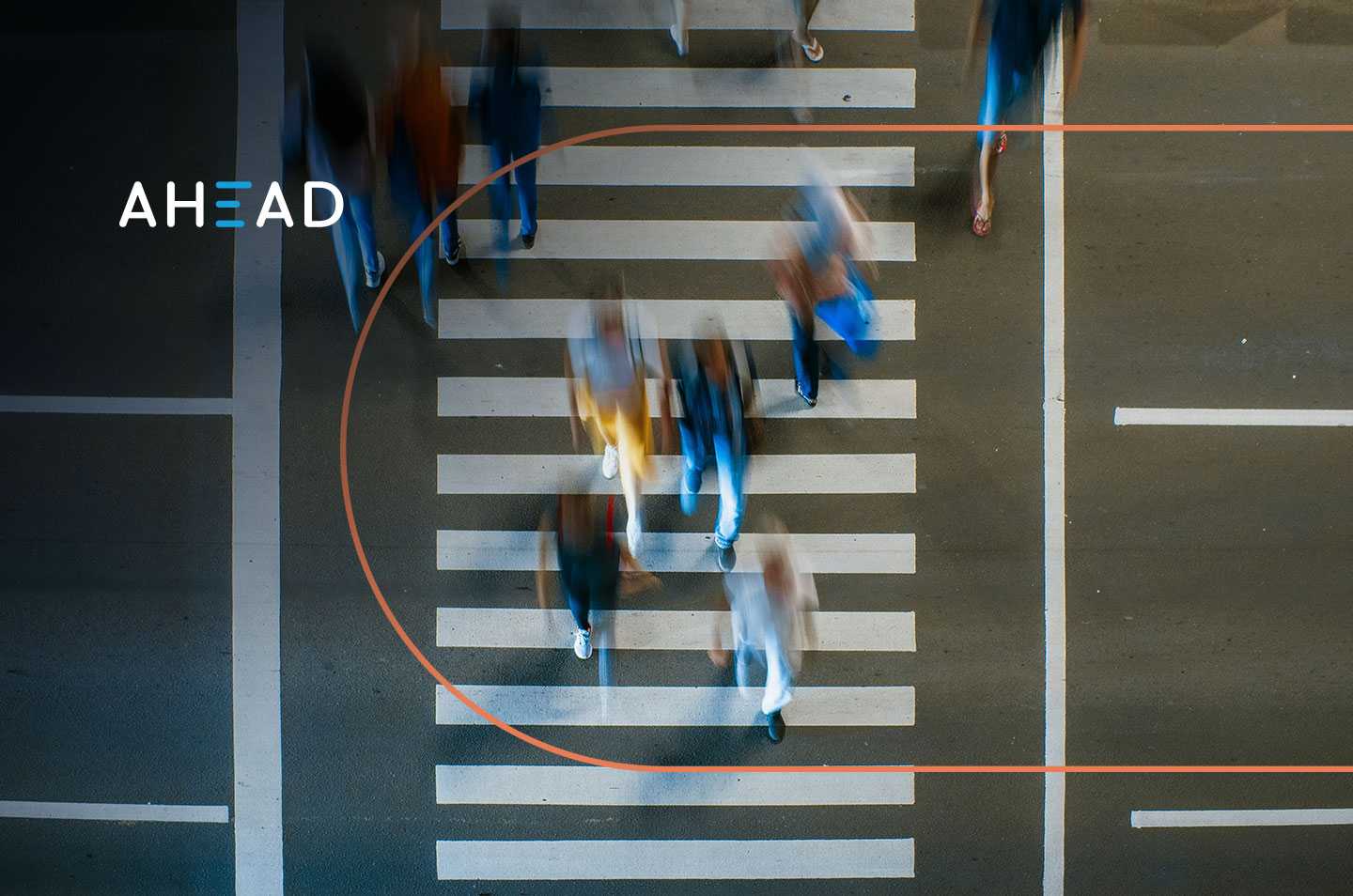 an arial view of people walking at a crosswalk with motion blur